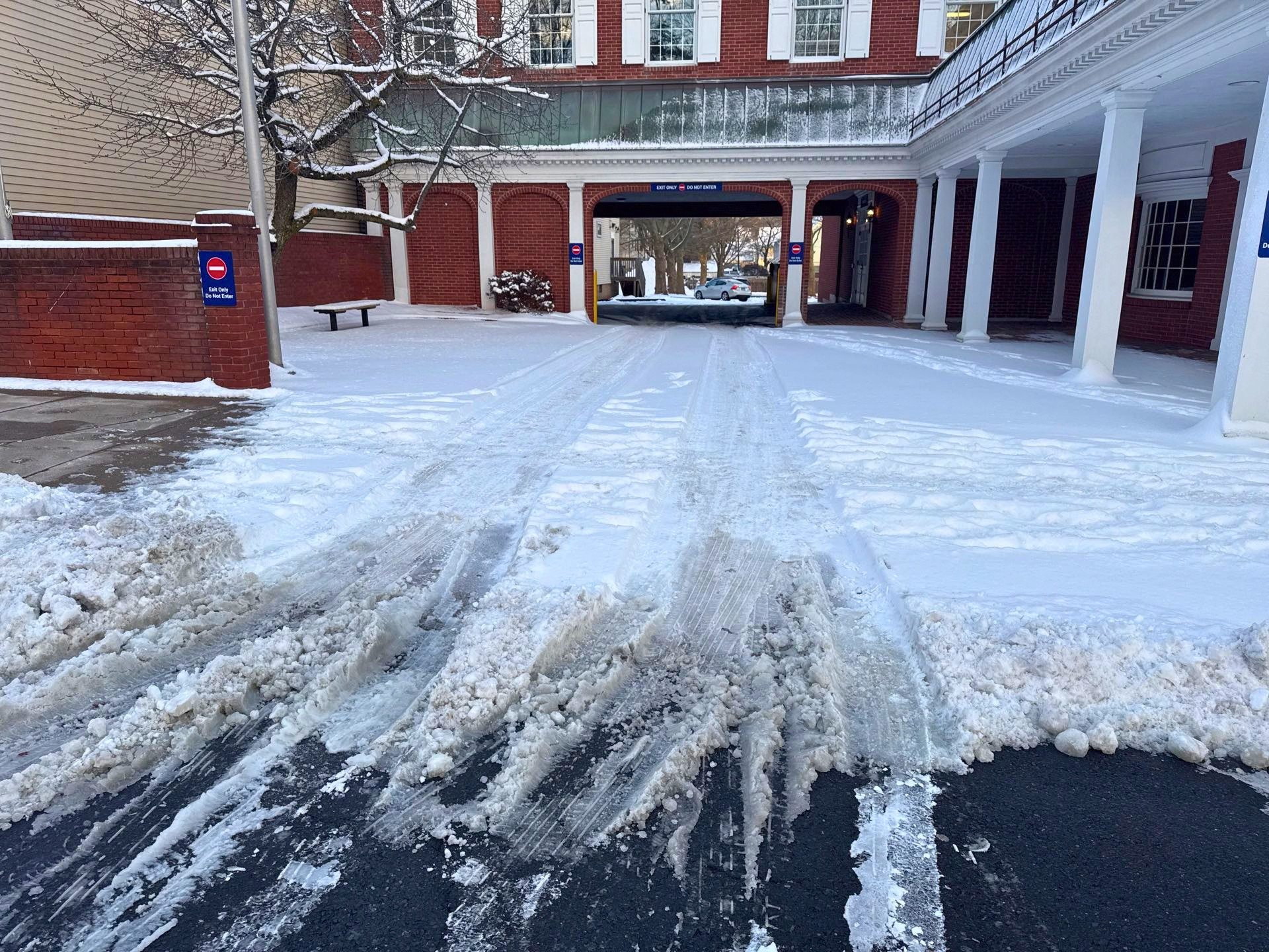 Commercial parking lot documented during post-storm snow verification