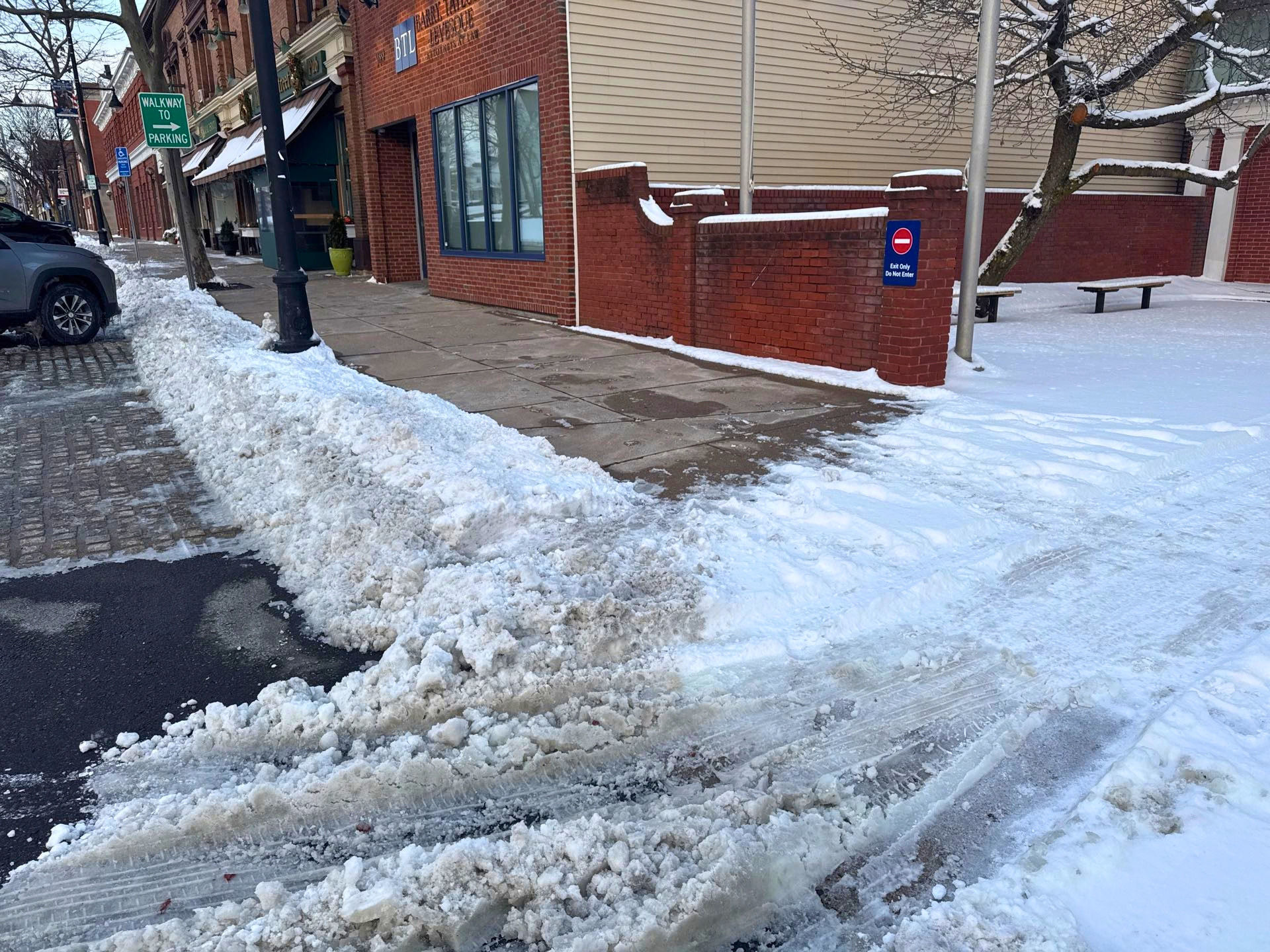 Snow-covered road entrance documented during post-storm inspection
